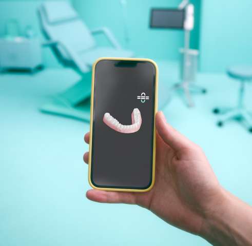 Aperçu de l'application DR SMILE sur un écran de téléphone mobile
