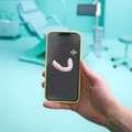 Aperçu de l'application DR SMILE sur un écran de téléphone mobile